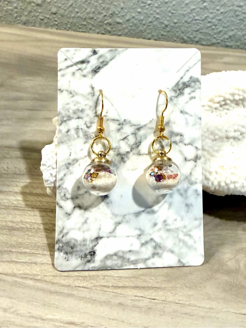 106. Glass globe earrings with multicolored crystals and beach sand